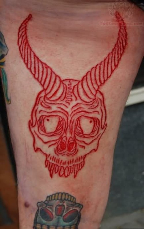 Red Ink Devil Horns Tattoo